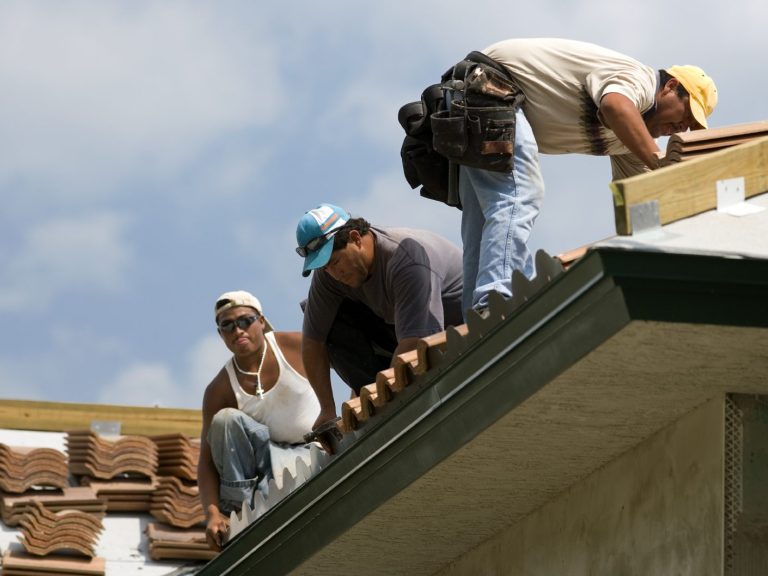 integrity roofing group team working on a roof