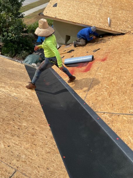 roof sheet with roofer walking